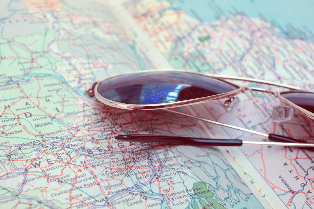 Magnifying glass resting on an old map